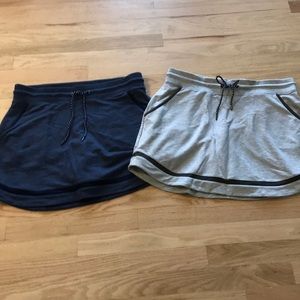 A grey and navy blue skirts